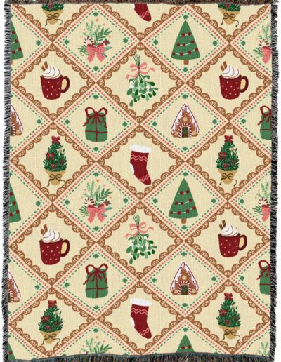 Woven throw blanket with a repeating diamond pattern featuring Christmas icons including mugs of cocoa, gifts, trees, stockings, mistletoe, and gingerbread houses on a cream background.